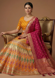 Mustard Yellow & Rani Pink Festive Lehenga Choli with Zari Weaving